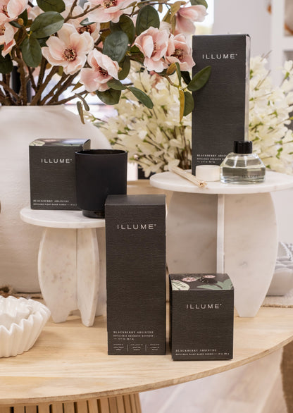 Blackberry Absinthe Fragrance Collection Scented Candle and Diffuser Staged on Marble Pedestals