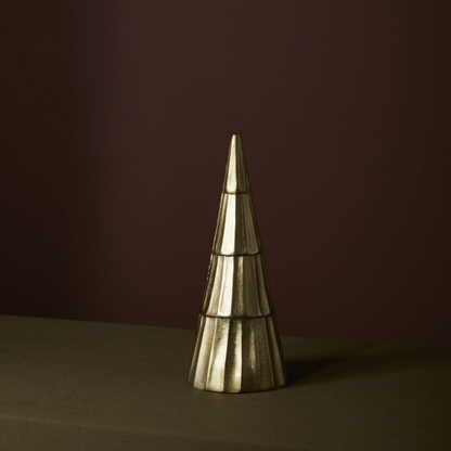 The Vida Tree, a lightweight metal tree that boasts a stylish ridged design and a shiny antique gold finish, perfect for tabletop or mantle decor during the holidays.