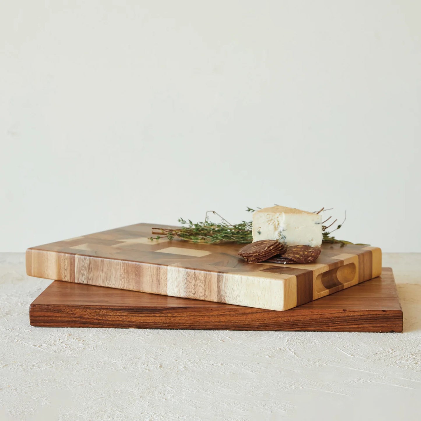 Brendal Suar Wood Cutting or Serving Board with Modern Visual Texture Styled with Cheese, Herbs, and Cured Meat for Charcuterie