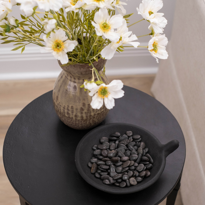 Cairo Textured Ebony Black Matte Iron Modern Minimalist Slender Side Table Styled with Vase and Decorative Bowl with River Stones