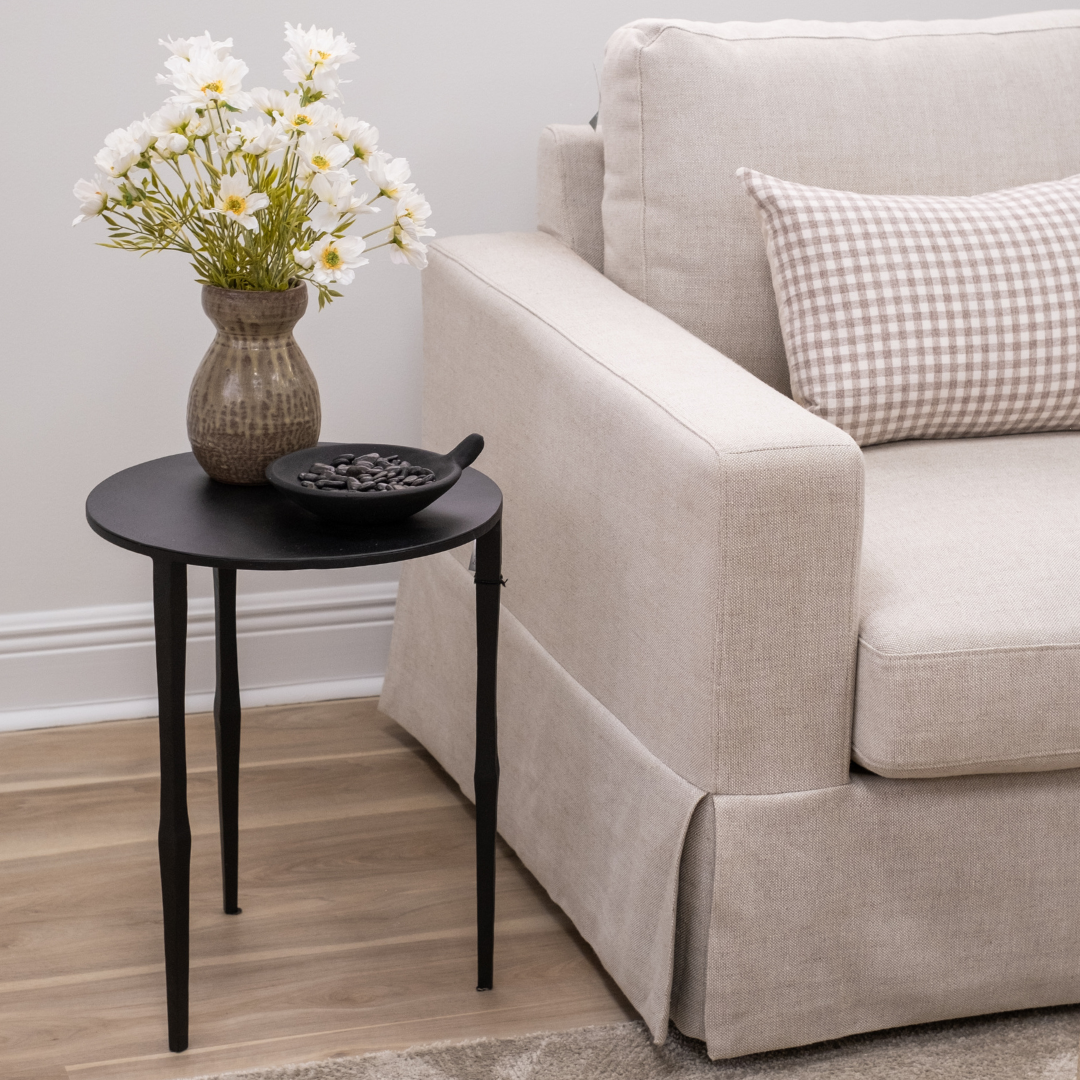 Cairo Ebony Black Matte Iron Modern Minimalist Slender Side Table Styled with Vase and Decorative Bowl with River Stones