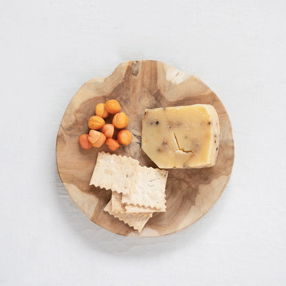 Fulmer Simple Round Natural Teakwood Food Safe Moisture Resistant Cutting Board or Serving Board styled with apricots, cheese, and crackers for charcuterie.