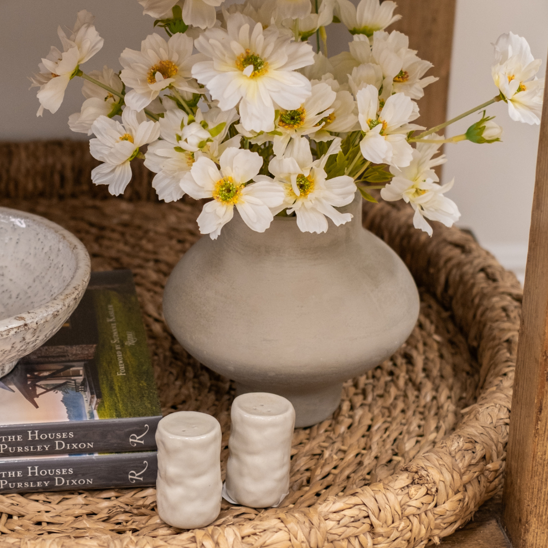 Lauris Textured Grey Paper Mache Modern Shaped Vase styled on Woven Tray with White Cosmos Faux Florals